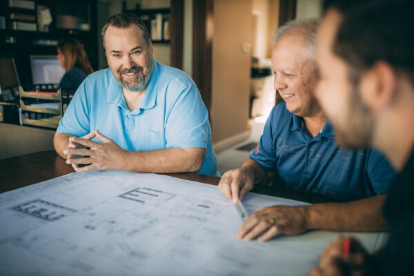 Michael Glore and Michael Key looking over blueprints